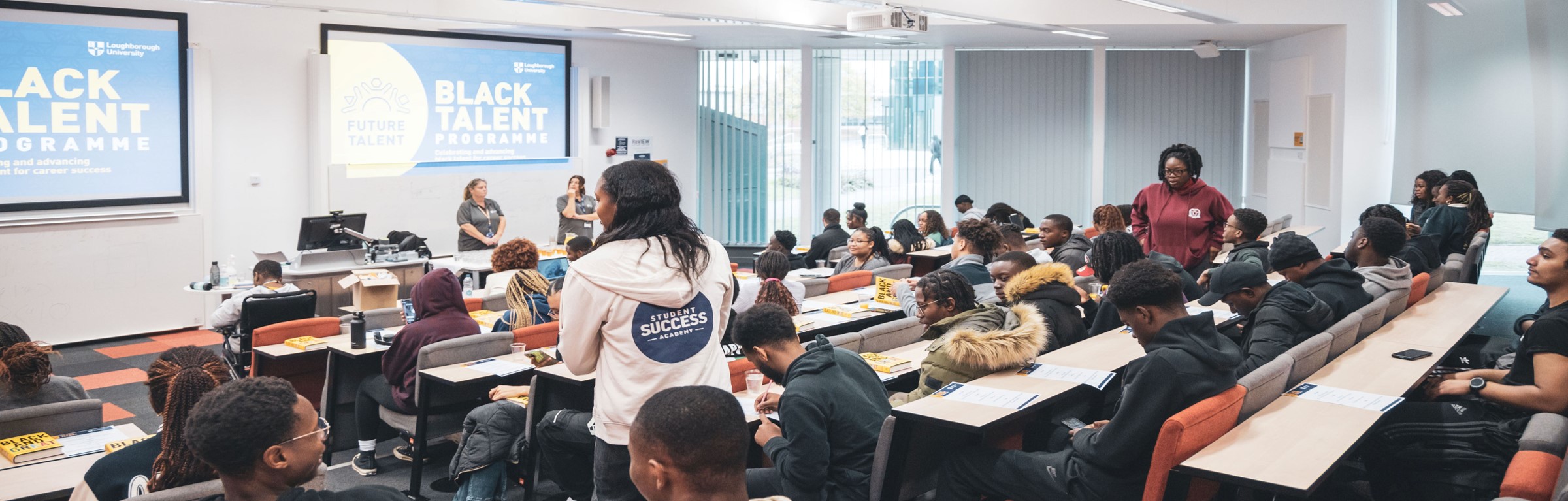 Students on the Black talent Programme sat in a lecture theatre attending a presentation
